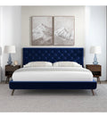 Monaco Blue Velvet Platform Bed angled view in styled bedroom