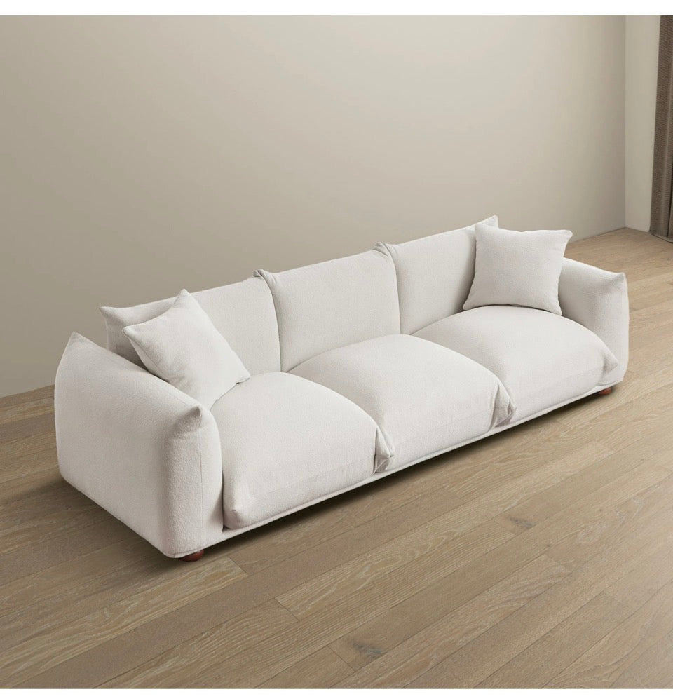The Kendall Sofa – angled lifestyle shot on light wood floor
