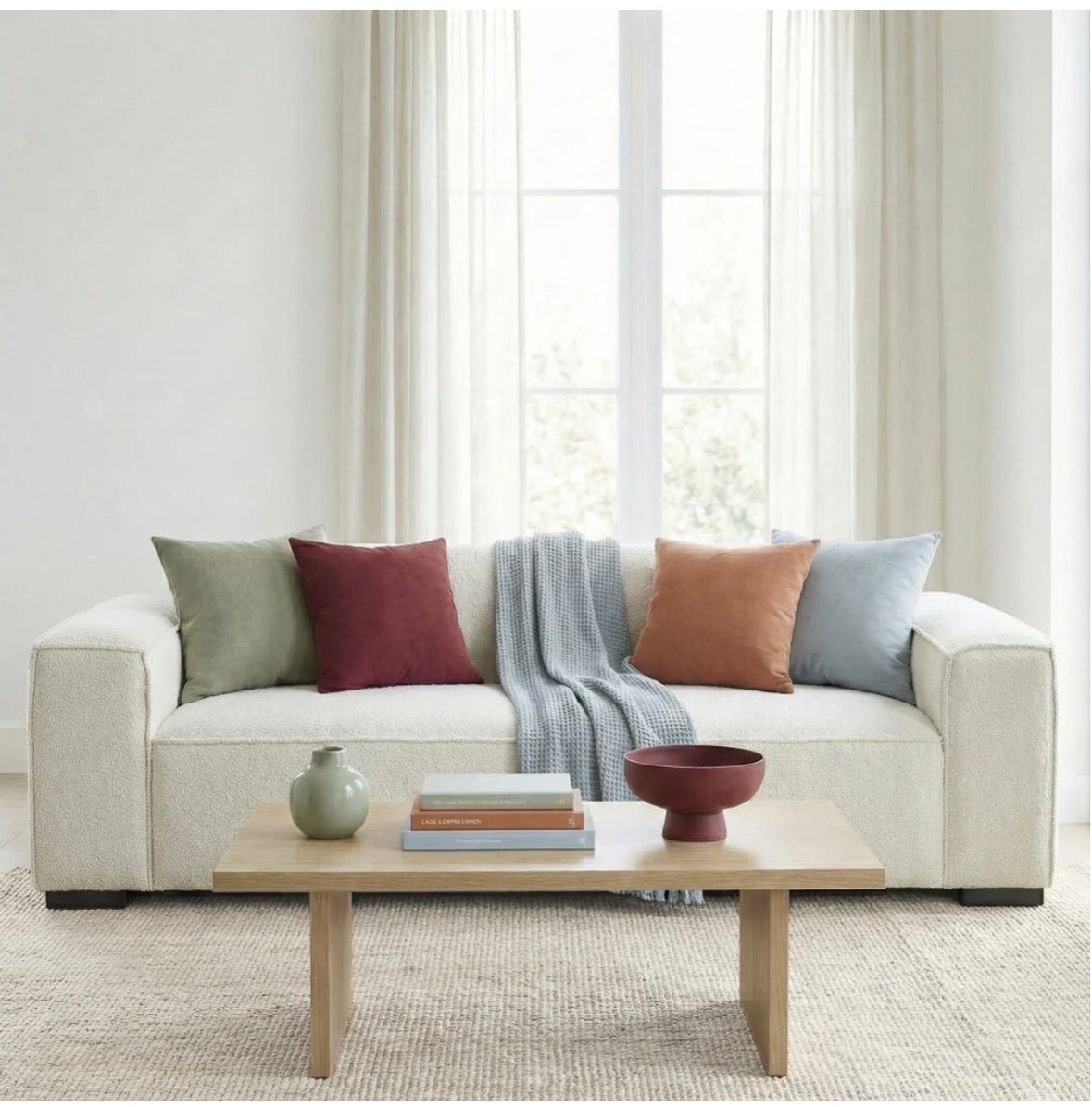 The Aspen sofa with colorful throw pillows in living room