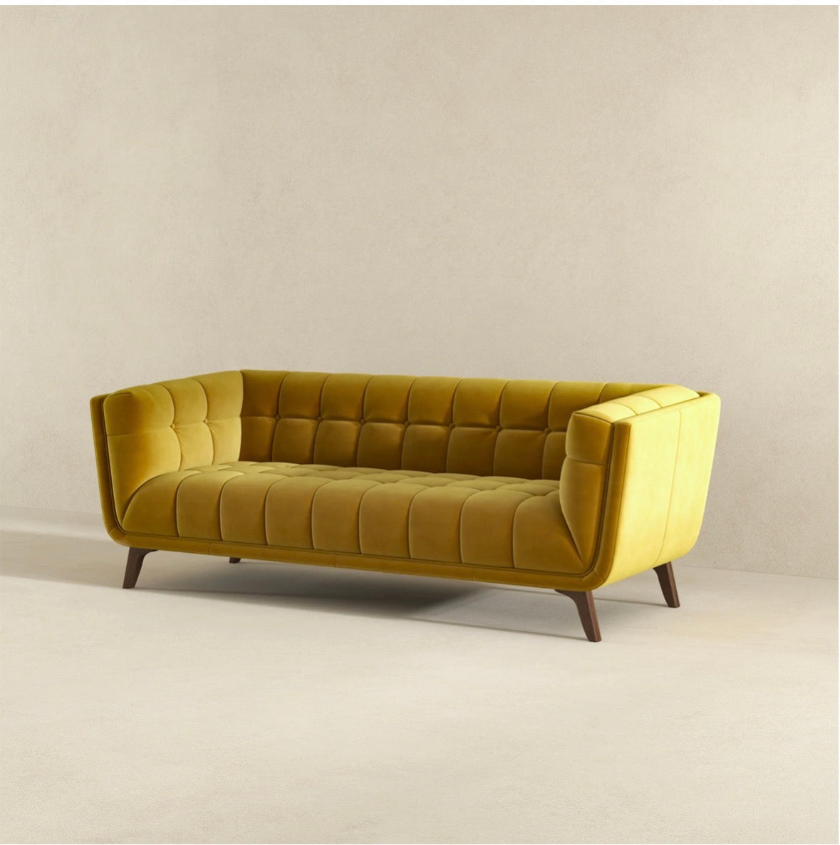 The Aurelia gold velvet sofa - side angle view