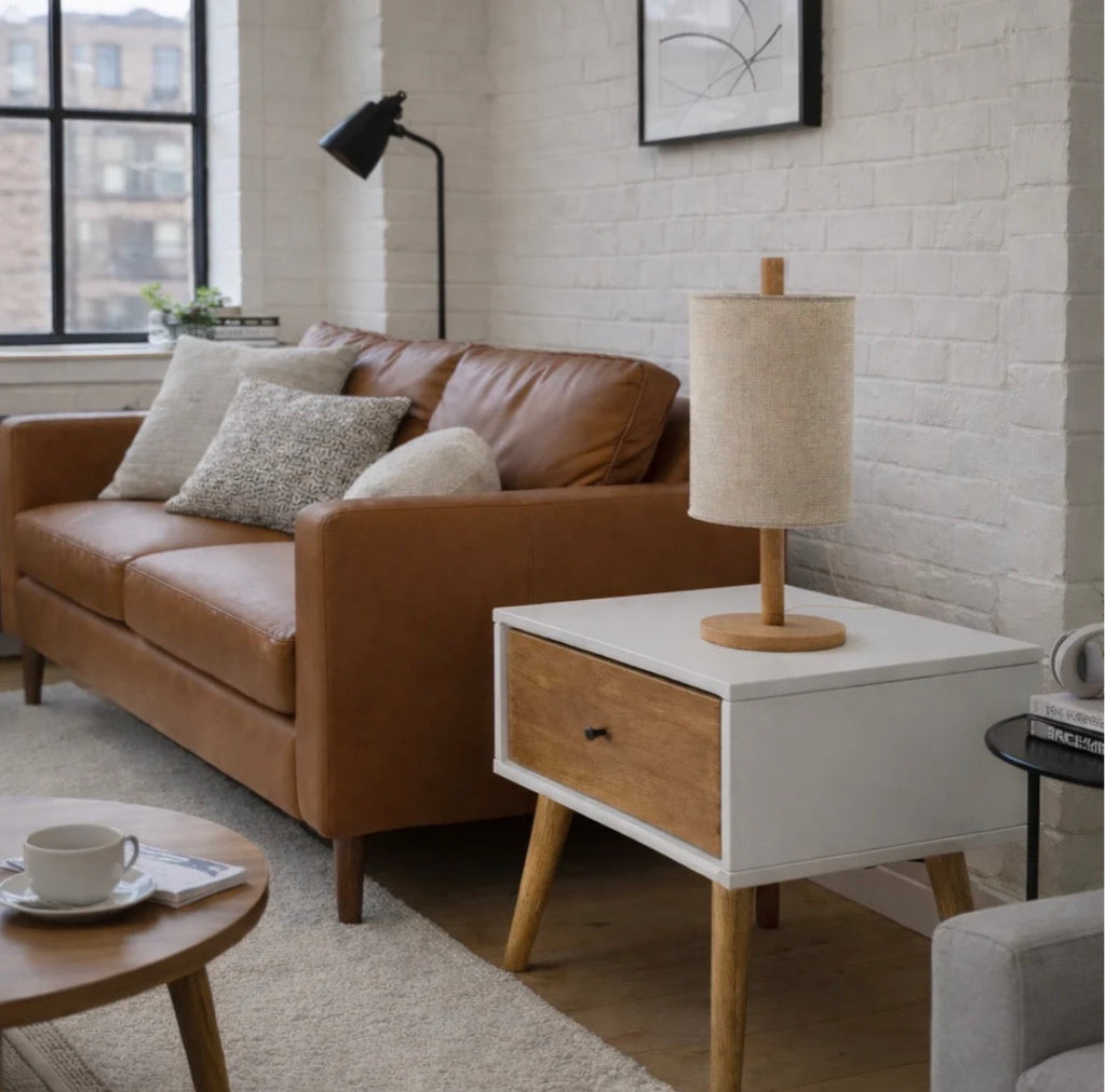 The Aria table lamp glowing warmly in an evening living room setting