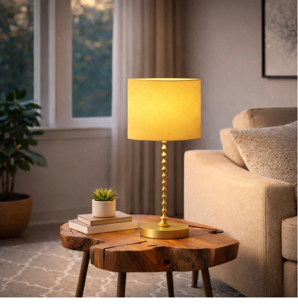The Solara ochre table lamp on a nightstand – close-up product shot