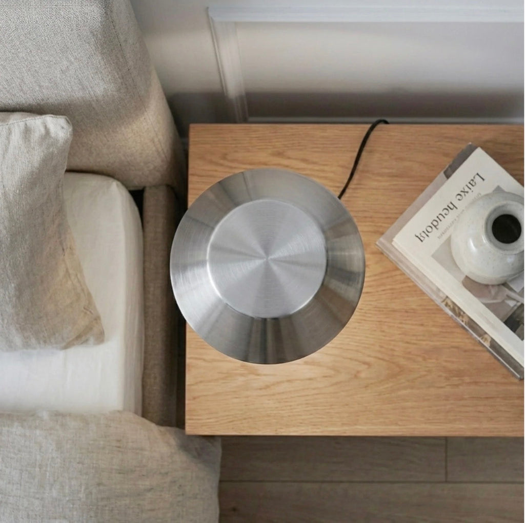 The Lumière brushed nickel table lamp – top-down view showing circular base
