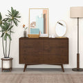 The Amara six-drawer walnut dresser on a plain background